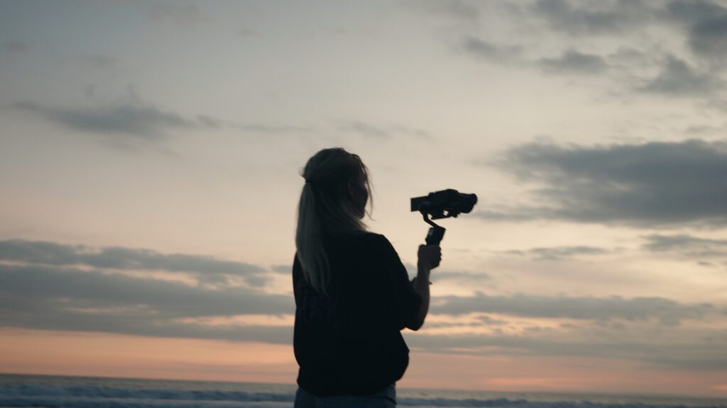 Creative videographer working on location during a travel shoot